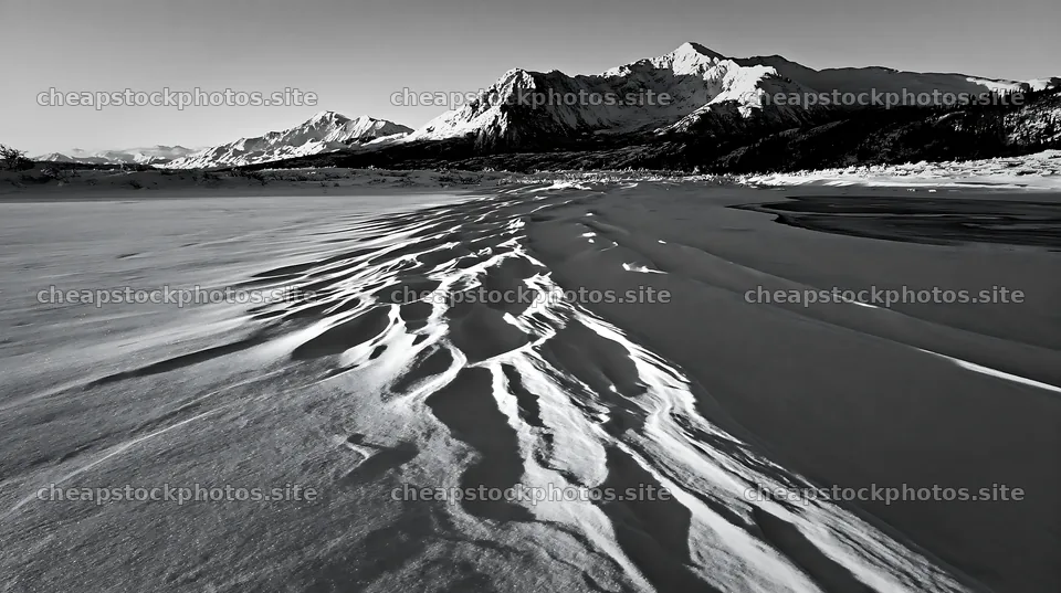 Snowbound meadow with mountains in winter landscape – stock photos 10608x5938