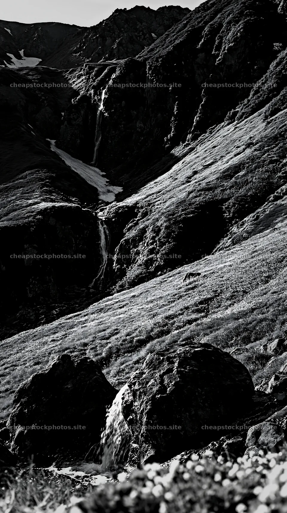 Toyama alpine meadow snowmelt rock foreground with waterfall – stock photos 5938x10608