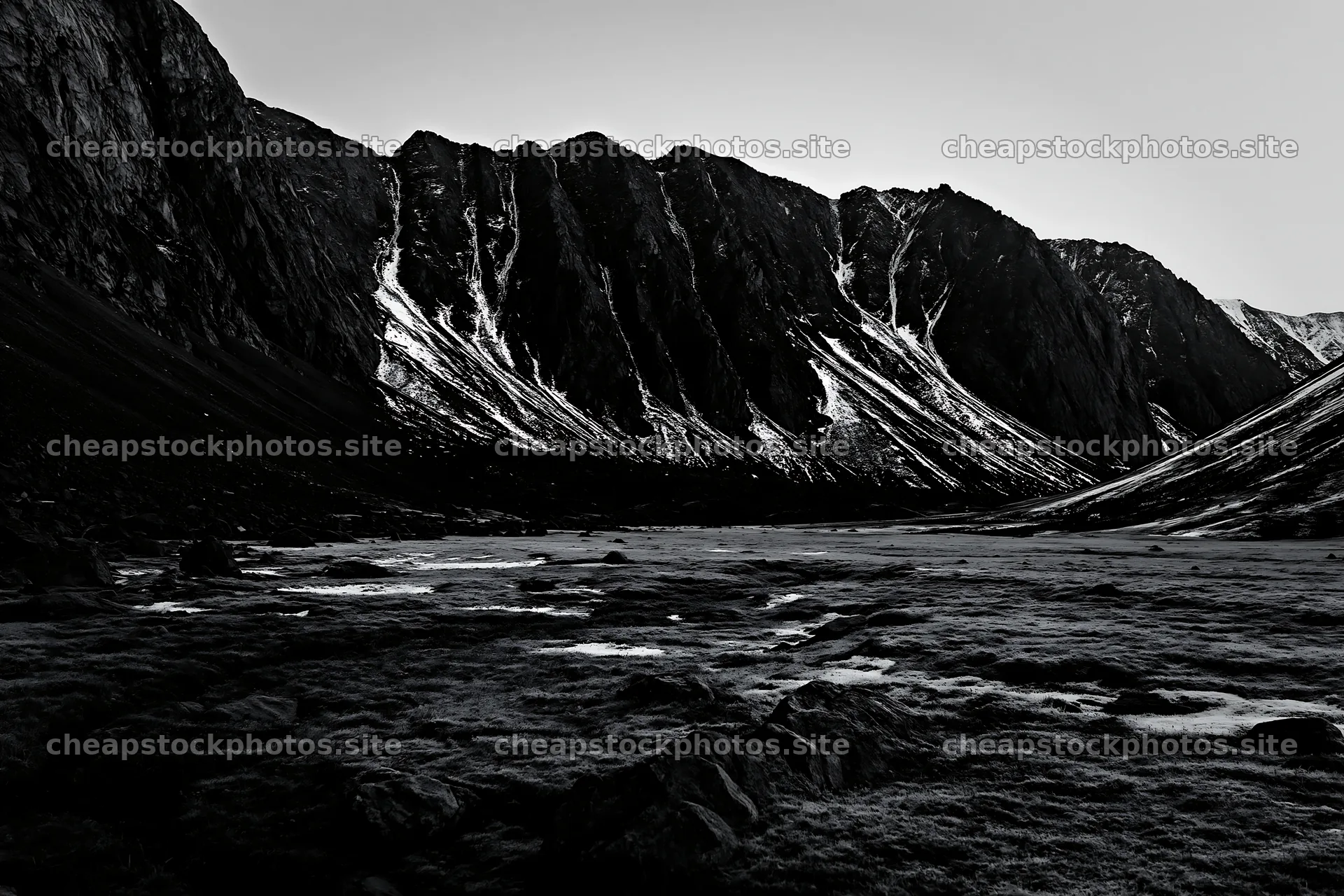 Meadow and crags in a black-and-white landscape – stock photos 9722x6480