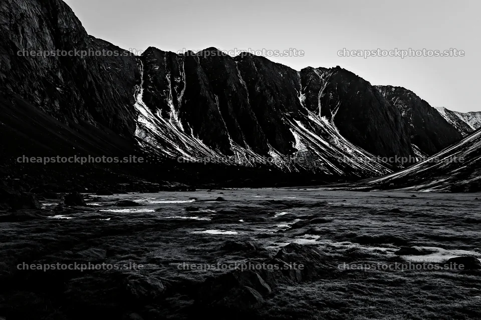 Meadow and crags in a black-and-white landscape – stock photos 9722x6480