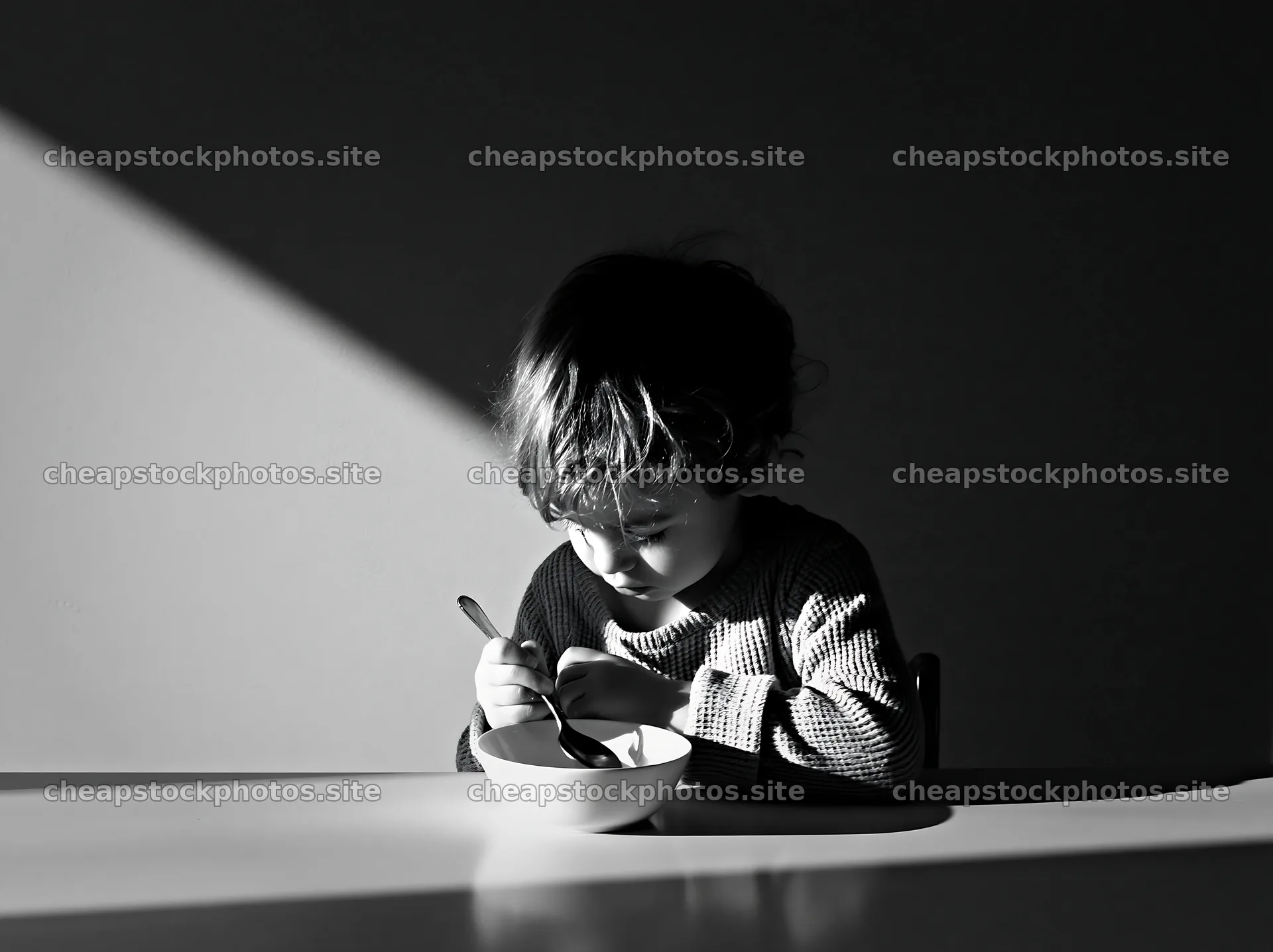 Empty bowl child sitting at a table – stock photos 9174x6866