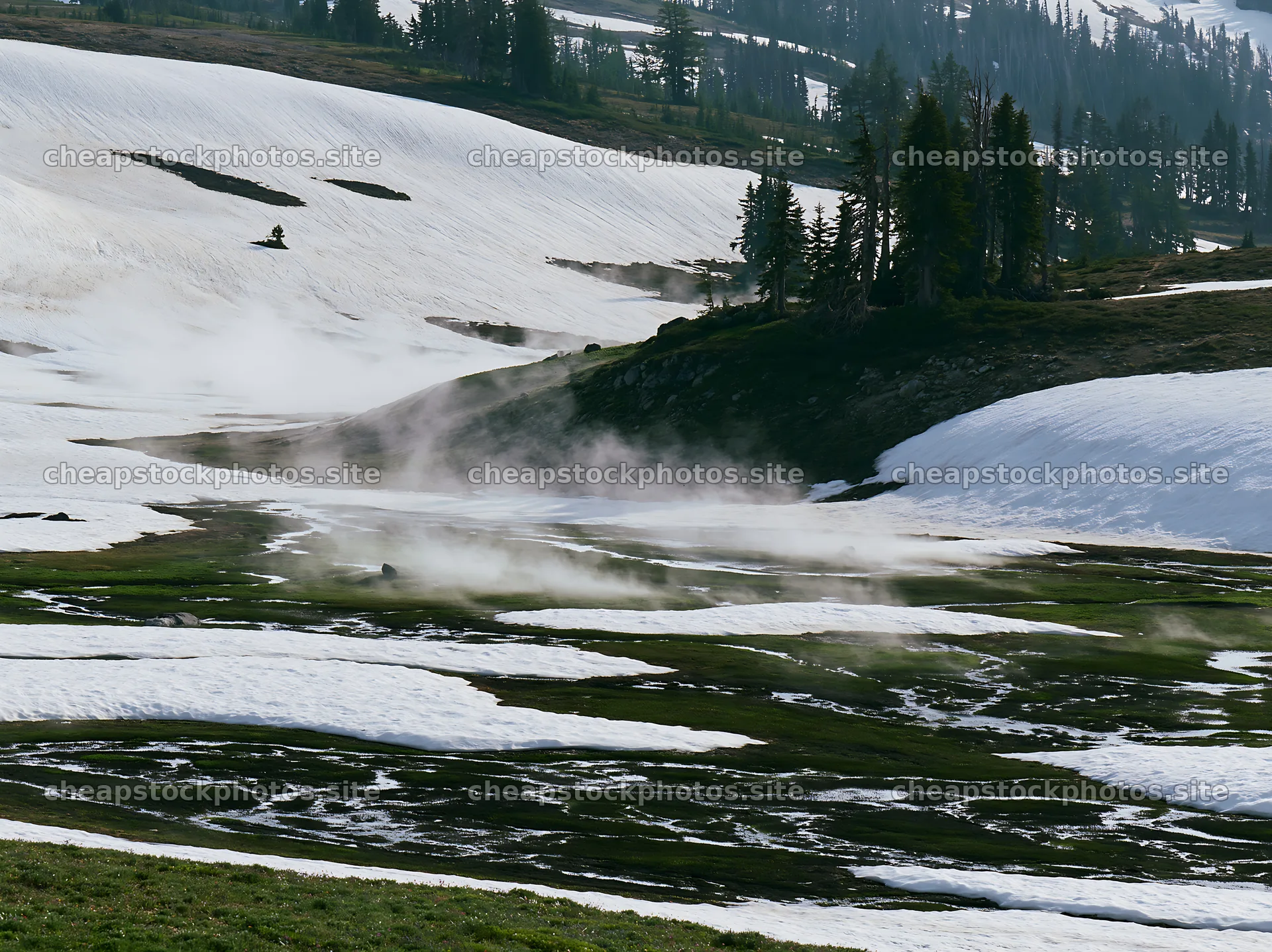 Meadow covered in snow with mist rising in the background – stock photos 9174x6866
