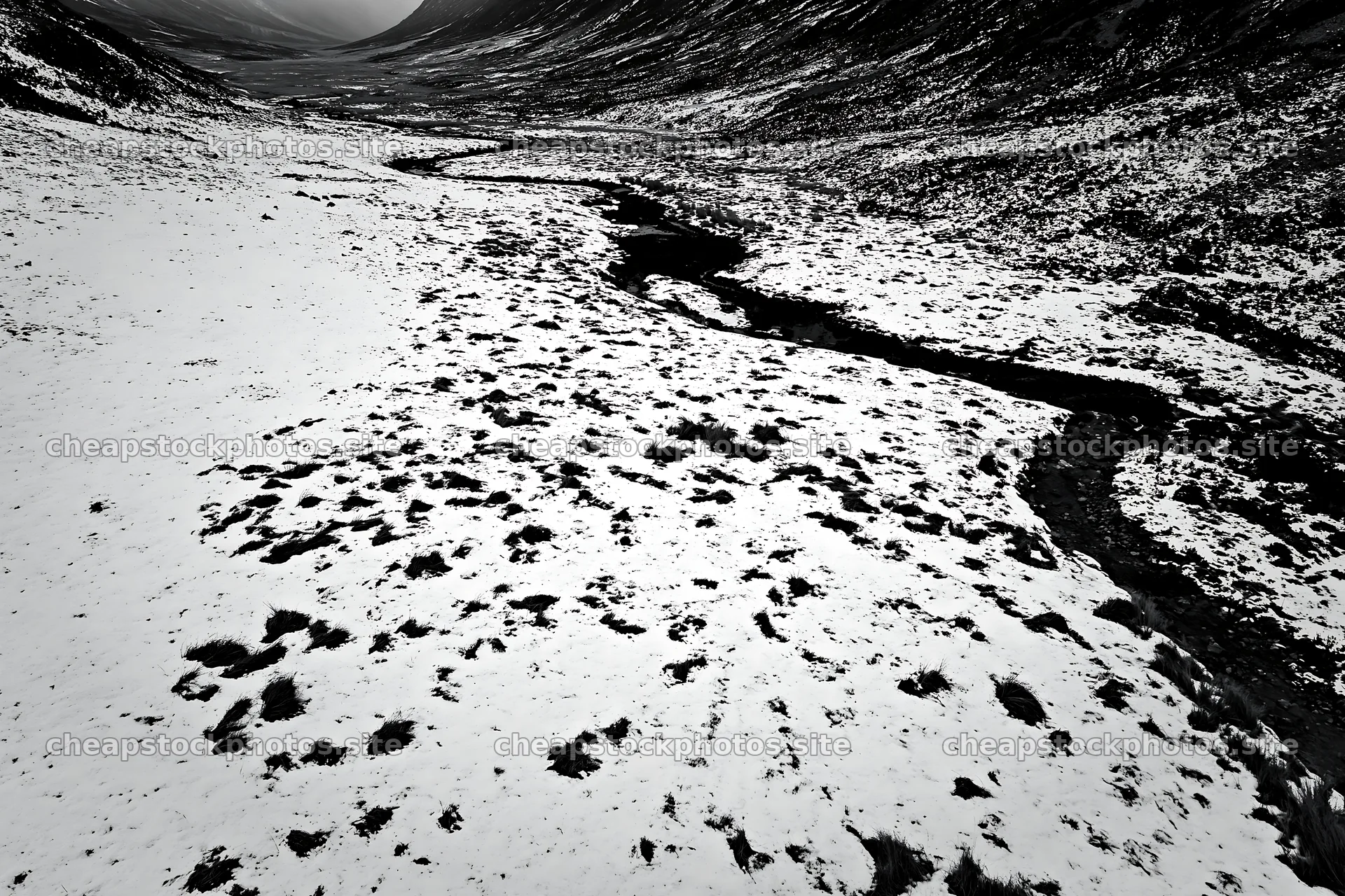 Aerial view of snowy meadow and valley with winding river – stock photos 9722x6480