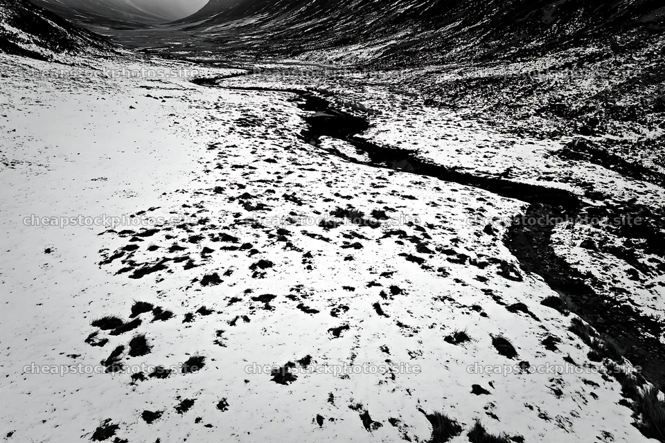 Aerial view of snowy meadow and valley with winding river – stock photos 9722x6480