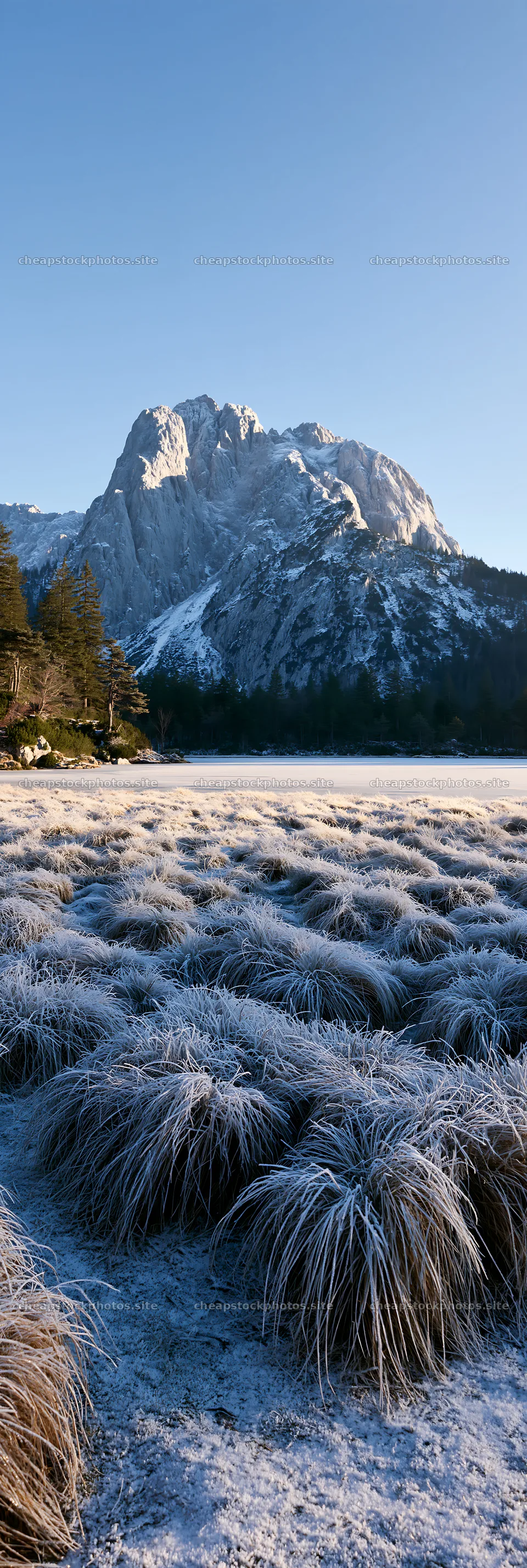 Frozen tarn meadow with mountains in winter – stock photos 4602x13690