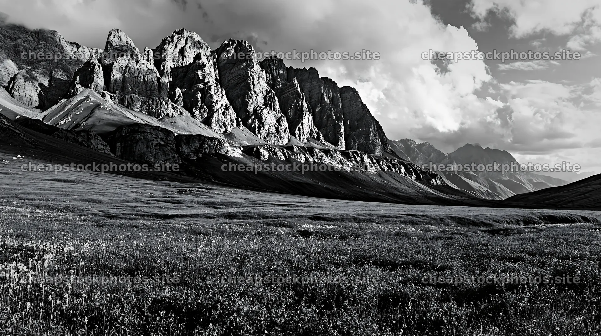 Meadow beneath crags with colorful flowers and rocky mountains – stock photos 10608x5938
