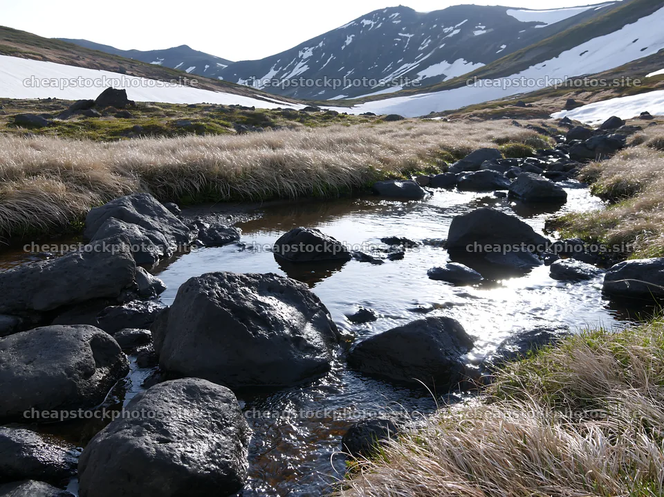 Akita snowmelt meadow with silver grasses and flowing stream – stock photos 9174x6866
