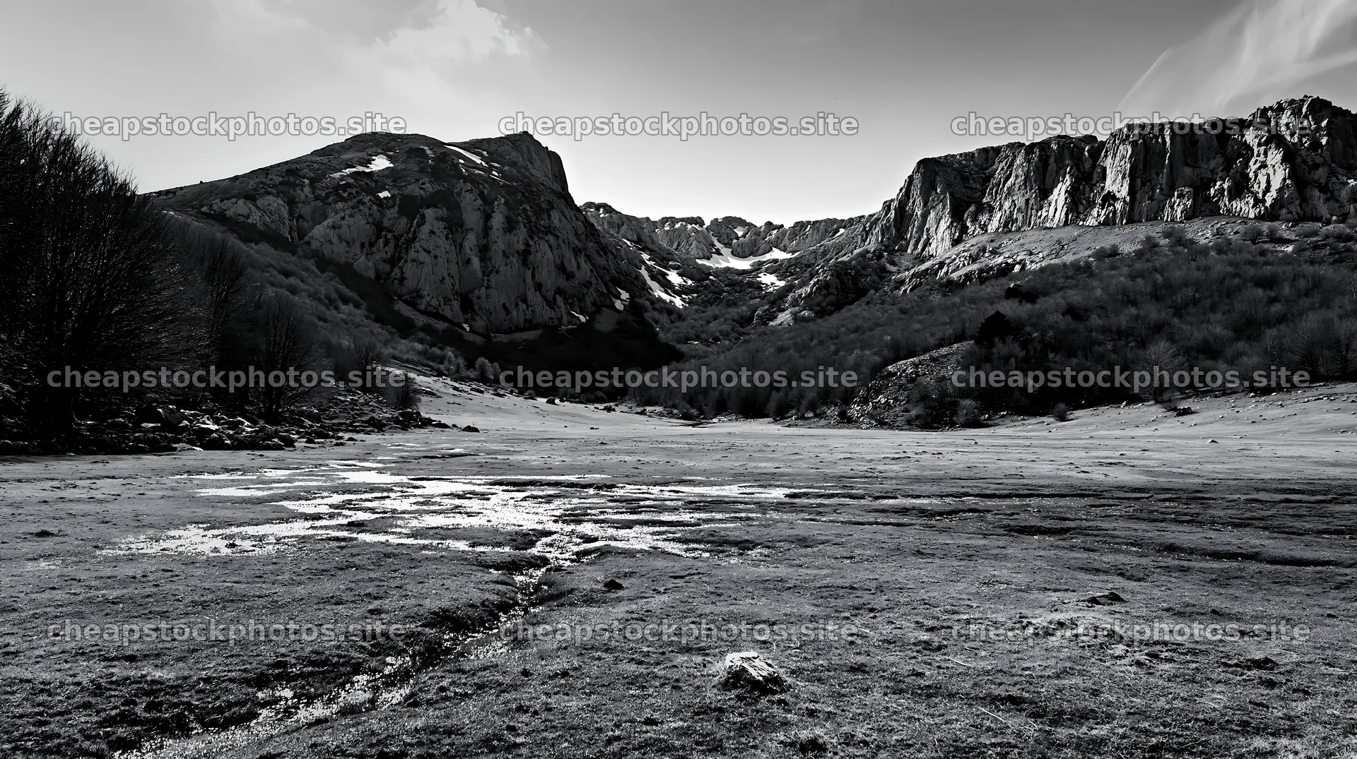 Meadow beneath crags with streams and rocky cliffs – stock photos 10608x5938