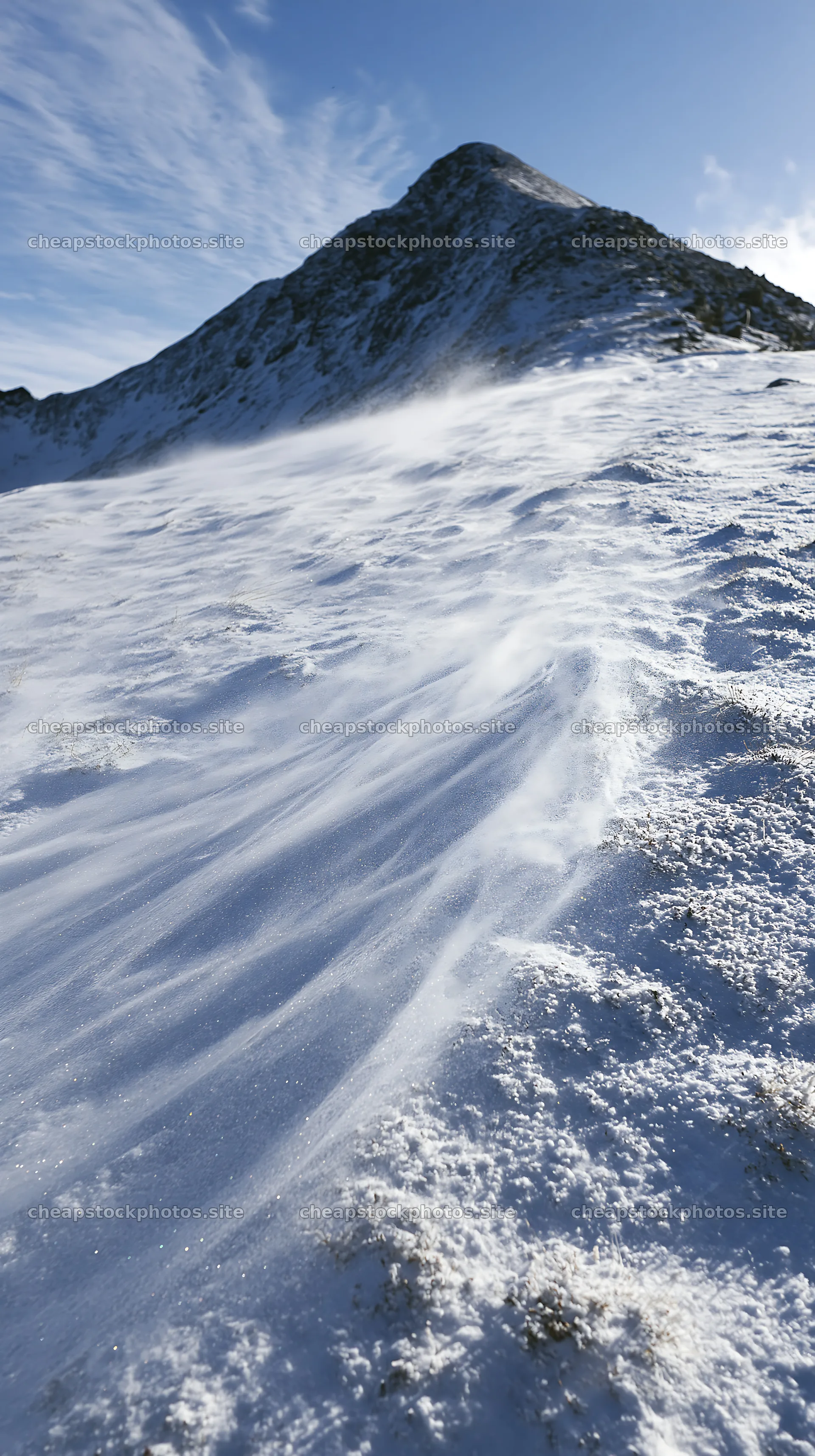 Lofoten coastal meadow winter snow with wind patterns on surface – stock photos 5938x10608