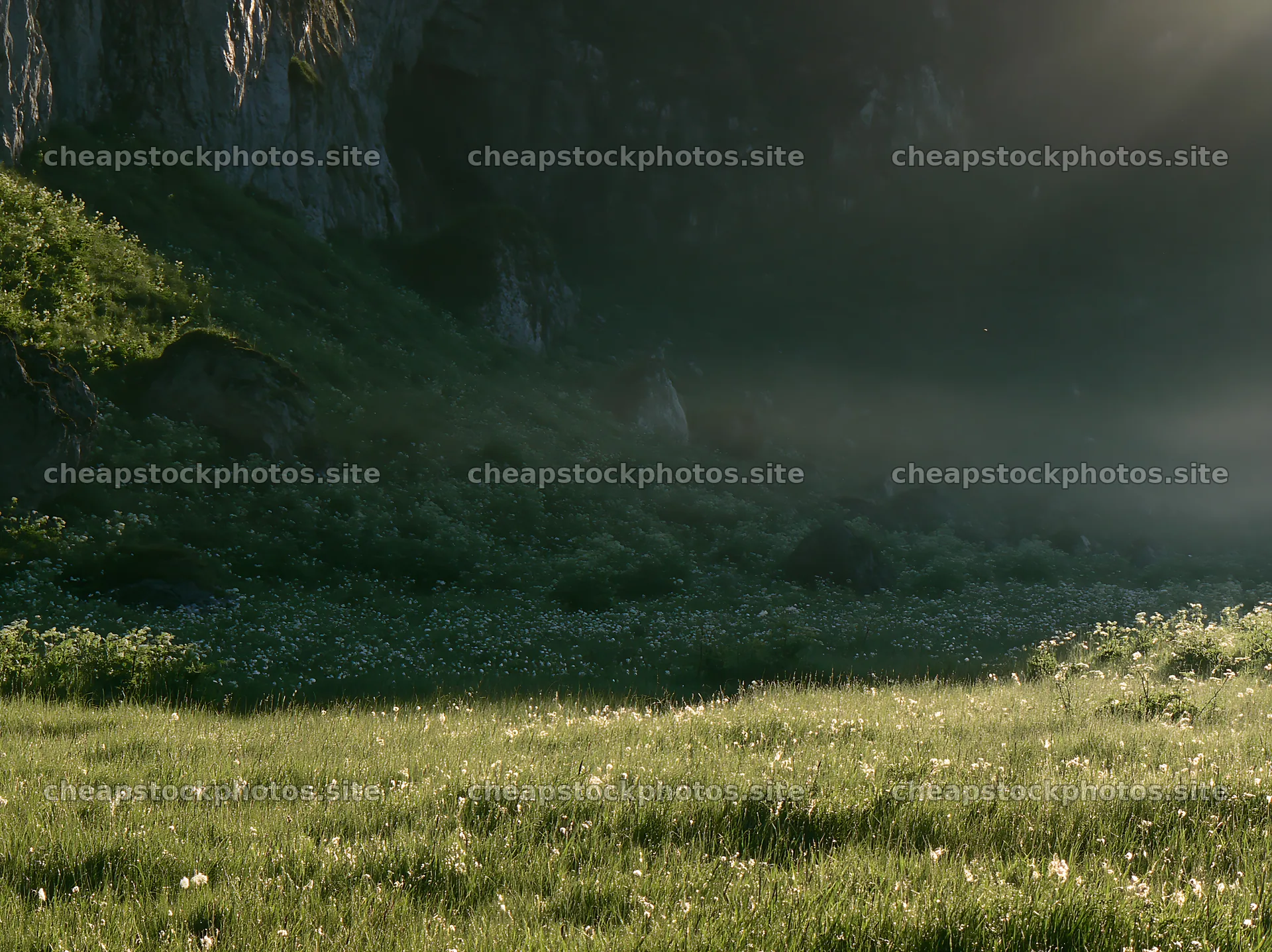 Meadow beneath crags with soft light and green grass – stock photos 9174x6866