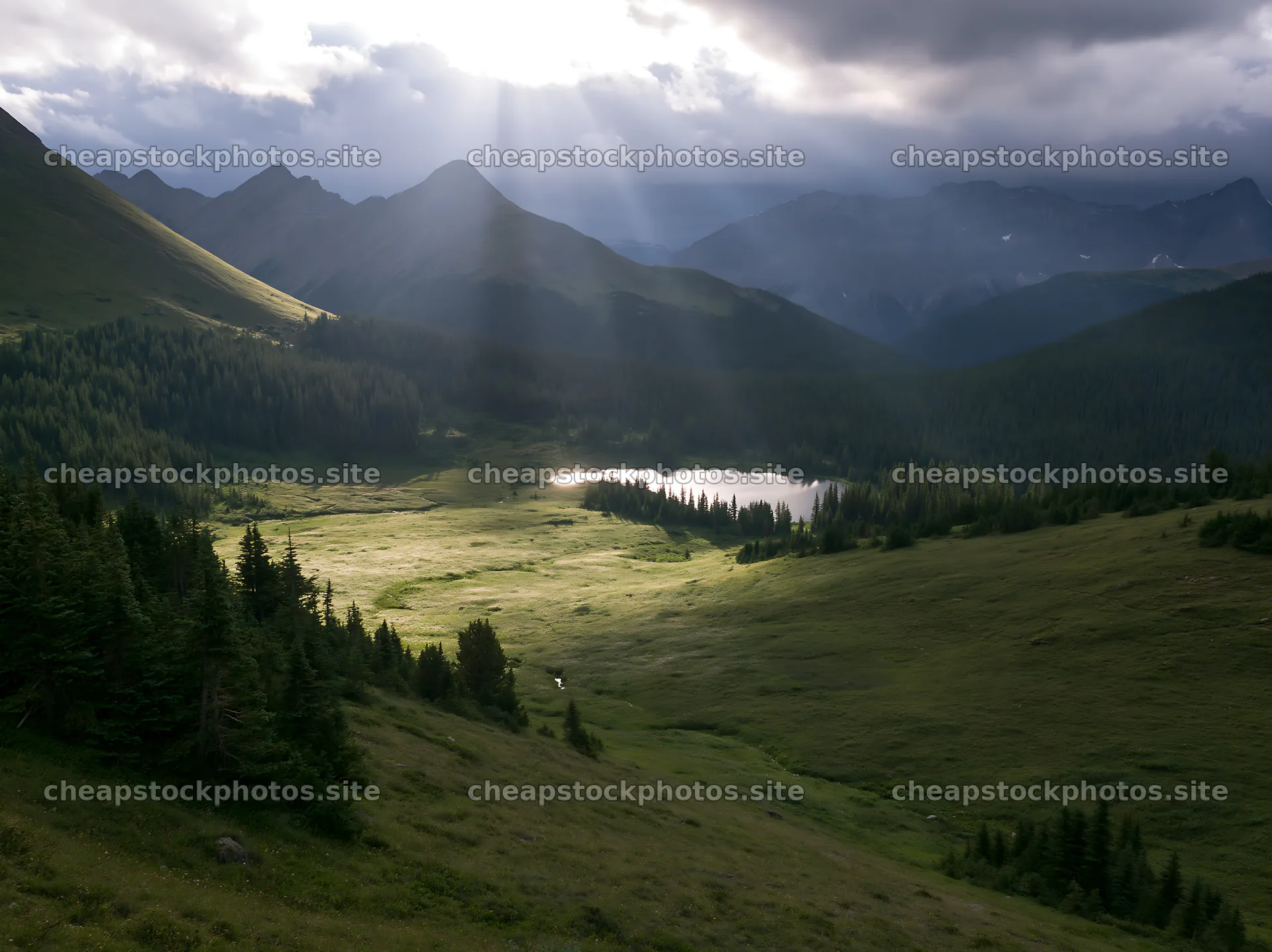 Sunshine rays over meadows and lake in Banff – stock photos 9174x6866