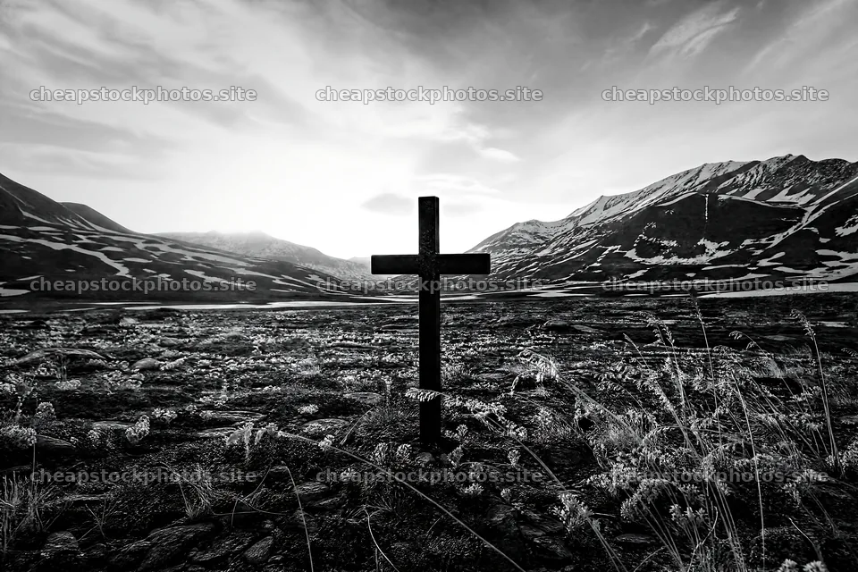 Christian cross in winter mountain meadow with distant peaks – stock photos 9722x6480