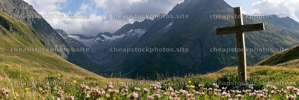 Wooden Christian cross in mountain meadow surrounded by flowers – stock photos 13690x4602