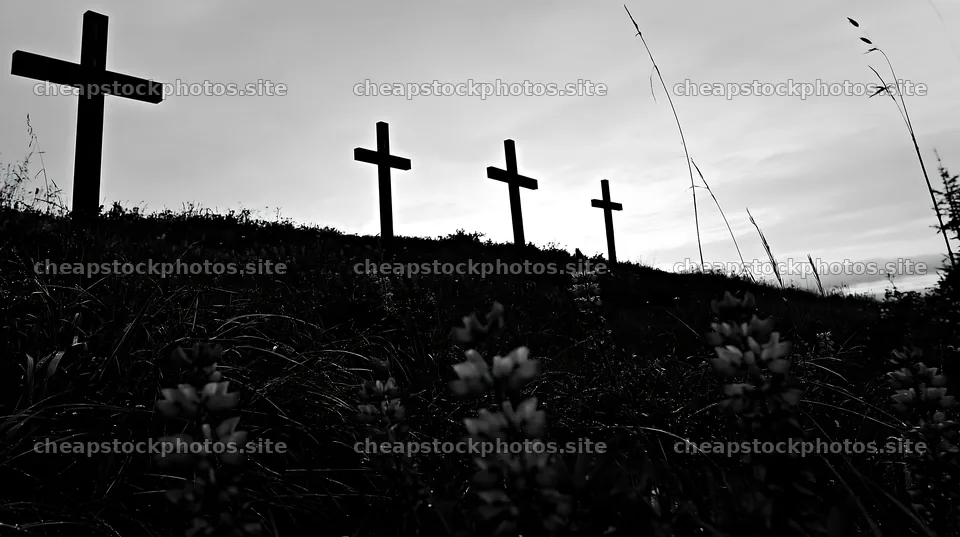 Christian crosses in rain soaked meadow at dusk – stock photos 10608x5938