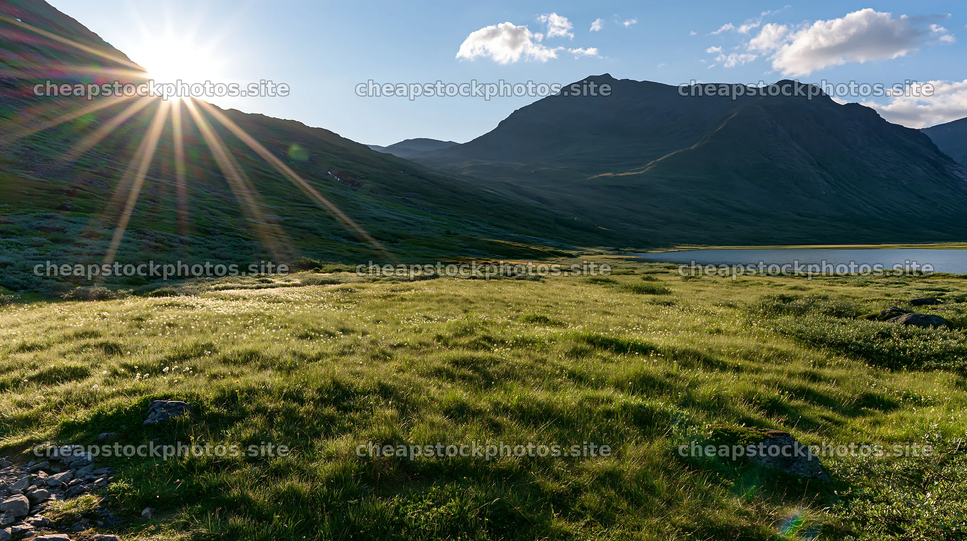 Sunbeams over Jotunheimen valley meadow at dusk – stock photos 10608x5938