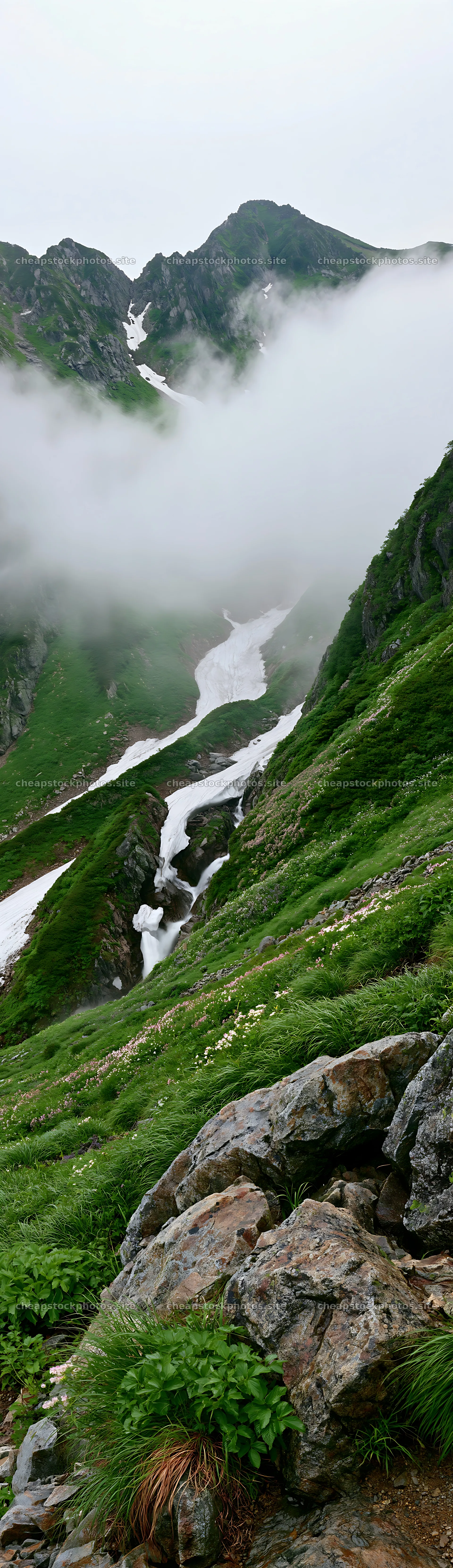 Snowmelt stream flows through Toyama alpine meadow with rocks – stock photos 4268x14762