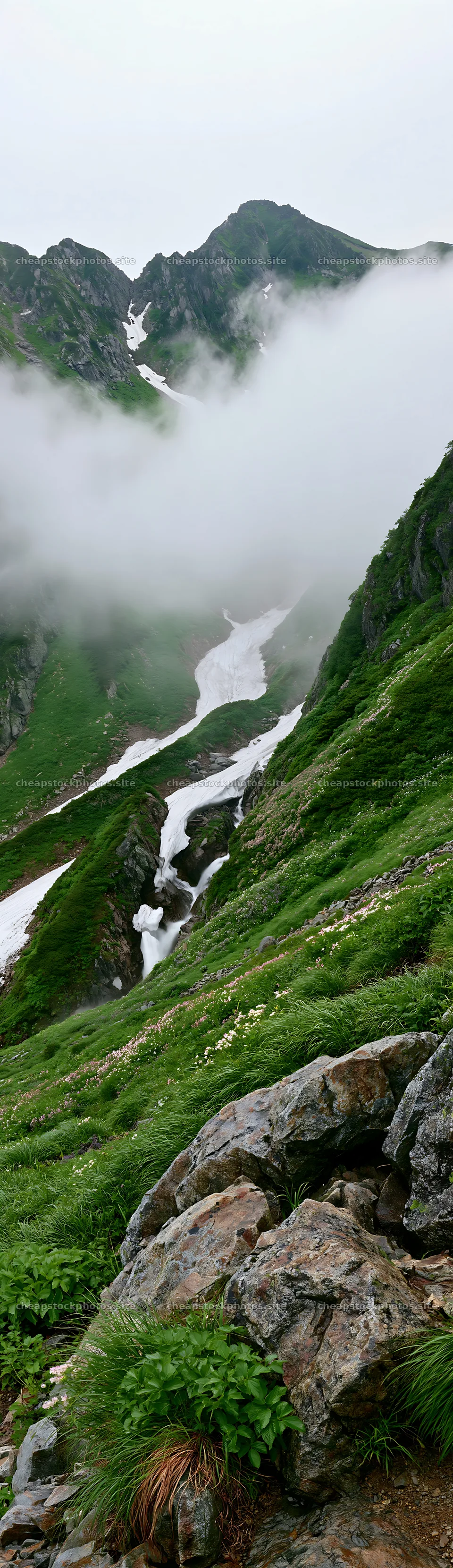 Snowmelt stream flows through Toyama alpine meadow with rocks – stock photos 4268x14762