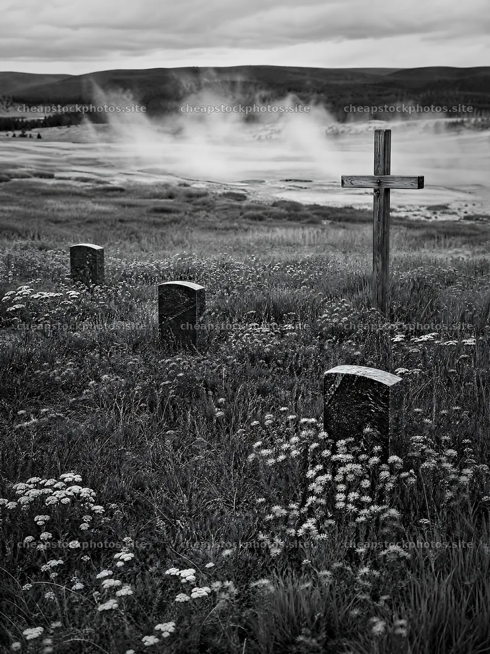Wooden Christian cross in hot spring meadow with gravestones – stock photos 6874x9166