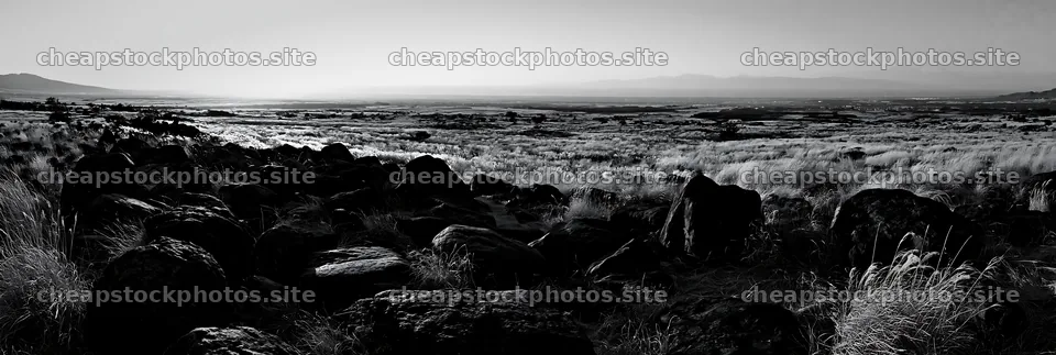 Kanagawa volcanic stones in a meadow under clear skies – stock photos 13690x4602