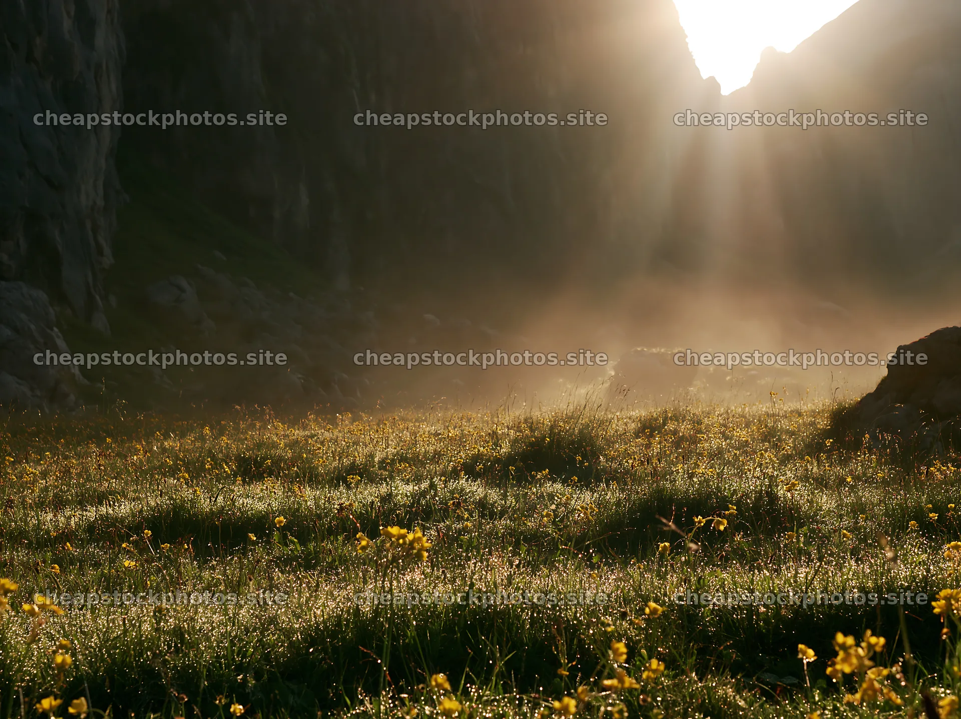 Meadow beneath crags with sunlight illuminating the landscape – stock photos 9174x6866