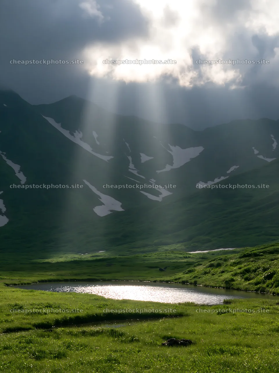 Light rays over Daisetsuzan alpine meadow and pond – stock photos 6866x9174